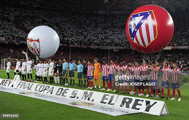 Atletico Madrid and Sevilla players pose before the King's Cup final match Sevilla against Atletico Madrid at the Camp Nou stadium in Barcelona on...