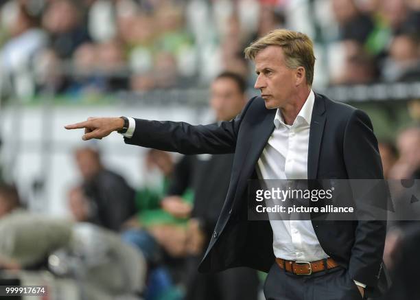 Wolfsburg's manager Andries Jonker gives instructions from the touchline during the German Bundesliga soccer match between VfL Wolfsburg and Hanover...