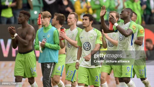 Wolfsburg player leave the field at the end of the German Bundesliga soccer match between VfL Wolfsburg and Hanover 96 in the Volkswagen Arena in...