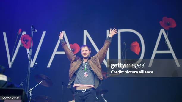 Marco Fitzthum, the singer and guitarist with the band Wanda, performs at the Lollapalooza festival in Hoppegarten, Germany, 9 September 2017. The...