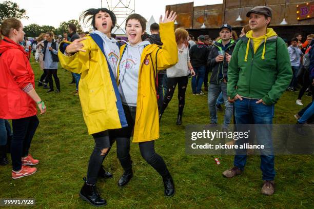 Two revellers dance to electronic music at the Lollapalooza festival in Hoppegarten, Germany, 9 September 2017. The music festival is held over two...