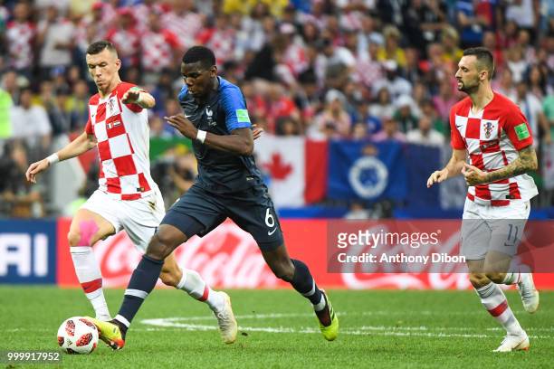 Ivan Perisic of Croatia, Paul Pogba of France and Marcelo Brozovic of Croatia during the World Cup Final match between France and Croatia at Luzhniki...