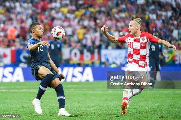 Kylian Mbappe of France and Domagoj Vida of Croatia during the World Cup Final match between France and Croatia at Luzhniki Stadium on July 15, 2018...