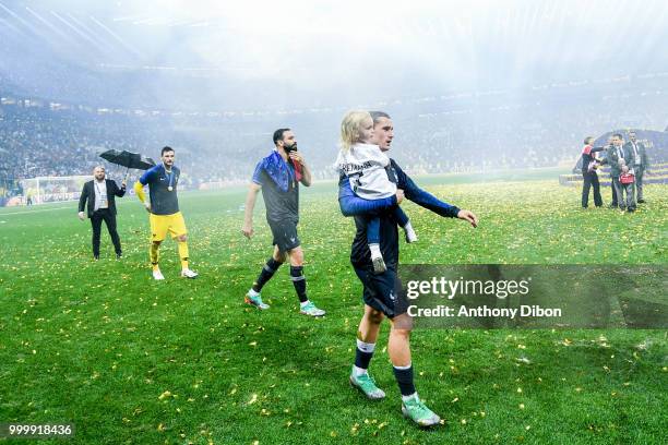 Antoine Griezmann of France with his daughter Mia Griezmann during the World Cup Final match between France and Croatia at Luzhniki Stadium on July...