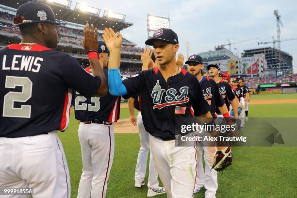 Carter Kieboom of Team USA celebrates with teammates after Team USA defeated the World Team in the SiriusXM All-Star Futures Game at Nationals Park...