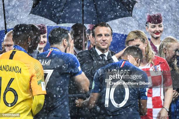 French President Emmanuel Macron and Croatia's President Kolinda Grabar Kitarovic with Kylian Mbappe of France during the World Cup Final match...