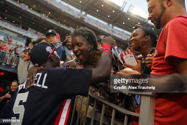 Futures Game MVP Taylor Trammell of Team USA celebrates with his family after the SiriusXM All-Star Futures Game at Nationals Park on Sunday, July...