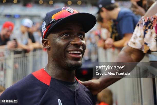 Futures Game MVP Taylor Trammell of Team USA celebrates with his family after the SiriusXM All-Star Futures Game at Nationals Park on Sunday, July...