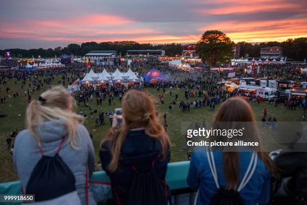 Festival visitors enjoy the sunset at the Lollapalooza festival in Hoppegarten, Germany, 9 September 2017. The music festival is held over two days...