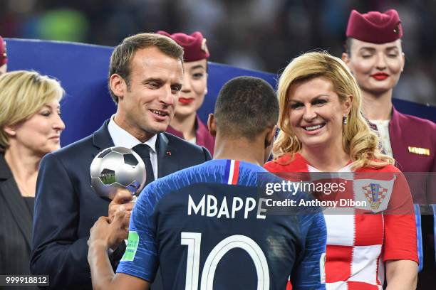 French President Emmanuel Macron, Croatia's President Kolinda Grabar Kitarovic and Kylian Mbappe of France during the World Cup Final match between...