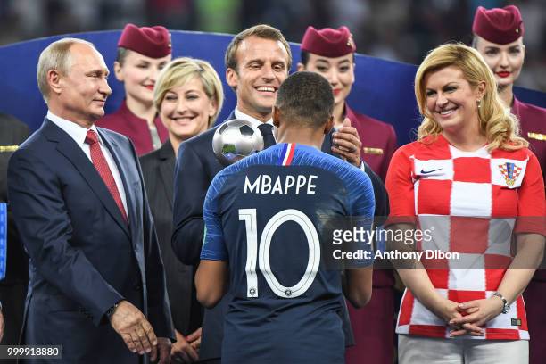 Russian President Valdimir Putin, French President Emmanuel Macron, Croatia's President Kolinda Grabar Kitarovic and Kylian Mbappe of France during...