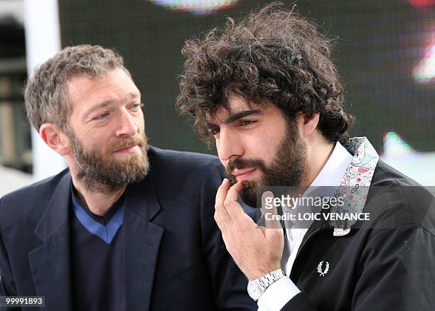 French actor Vincent Cassel and director Romain Gavras attend the Canal+ TV show "Le Grand Journal" at the 63rd Cannes Film Festival on May 19, 2010...