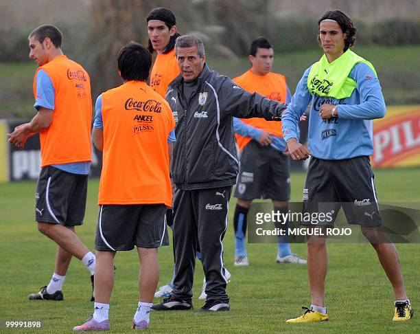 Uruguay's national team coach, Oscar Washington Tabarez gives instructions to his players during a training session of the Uruguayan football...