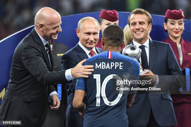 President Gianni Infantino, Russian President Valdimir Putin, French President Emmanuel Macron and Kylian Mbappe of France during the World Cup Final...