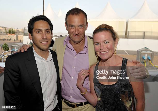 Andrew Marcus, Jeremy Morris and Erin Morris attend the "Art of Elysium Paradis Dinner and Party" at Michael Saylor's Yacht, Slip S05 during the 63rd...