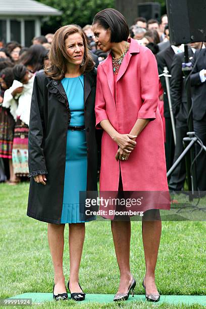 First lady Michelle Obama, right, talks with Margarita Zavala, wife of Felipe Calderon, Mexico's president, during a welcome ceremony at the White...