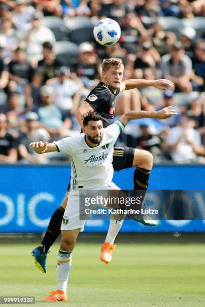 Walker Zimmerman of the Los Angeles Football Club and Diego Valeri of the Portland Timbers battle for control of the ball at Banc of California...
