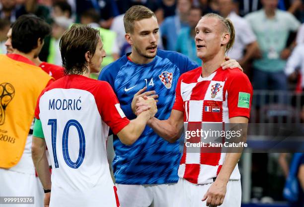 Luka Modric greets Domagoj Vida of Croatia following the 2018 FIFA World Cup Russia Final between France and Croatia at Luzhniki Stadium on July 15,...