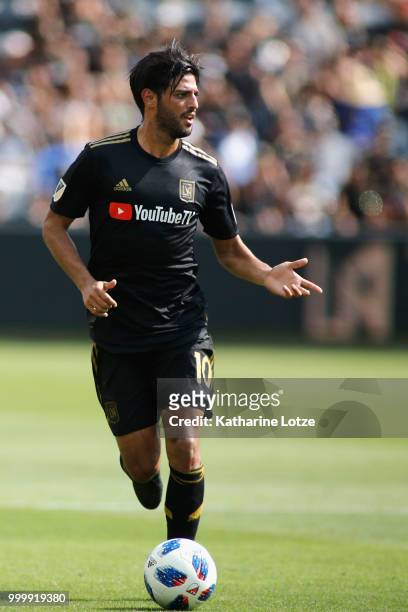 Carlos Vela of the Los Angeles Football Club dribbles down the field during action against the Portland Timbers at Banc of California Stadium on July...