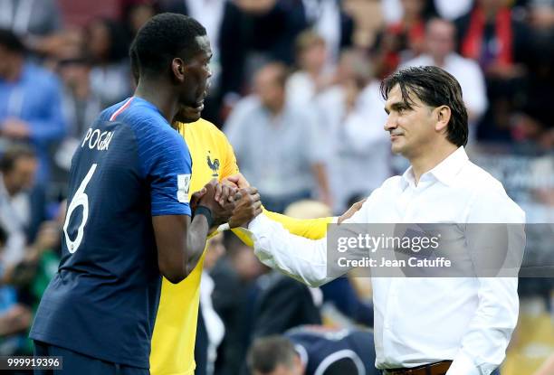 Paul Pogba of France, coach of Croatia Zlatko Dalic following the 2018 FIFA World Cup Russia Final between France and Croatia at Luzhniki Stadium on...