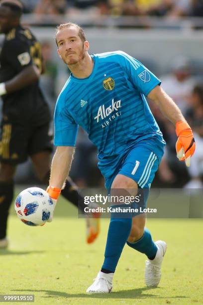 Goalkeeper Jeff Attinella of the Portland Timbers rolls the ball to a teammate during action against Los Angeles FC at Banc of California Stadium on...