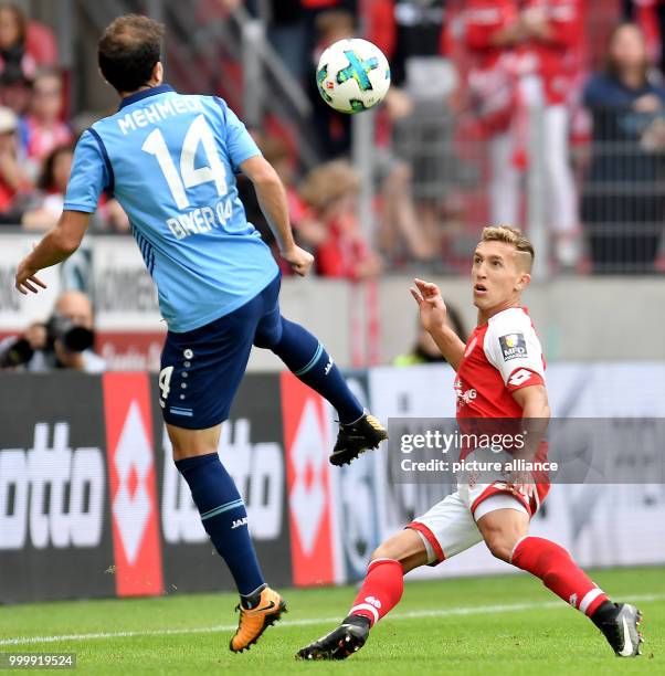 Mainz' Pablo de Blasis and Leverkusen's Admir Mehmedi in action during the Bundesliga soccer match between FSV Mainz 05 and Bayer Leverkusen at the...