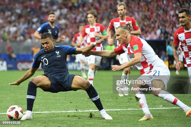 Kylian Mbappe of France and Domagoj Vida of Croatia during the World Cup Final match between France and Croatia at Luzhniki Stadium on July 15, 2018...