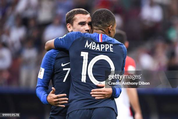 Antoine Griezmann celebrates a goal with Kylian Mbappe of France during the World Cup Final match between France and Croatia at Luzhniki Stadium on...