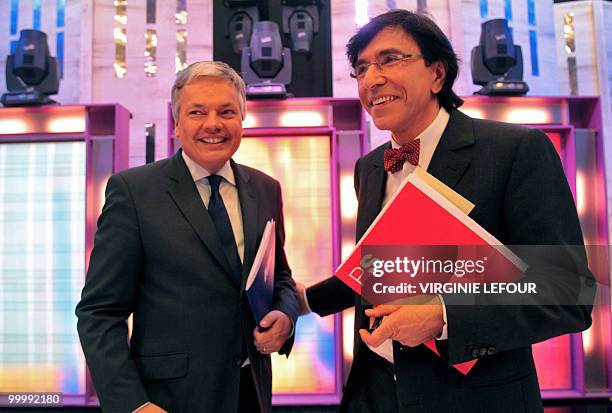 Belgian Minister of Finance and MR chairman Didier Reynders and PS chairman Elio Di Rupo smile after the first political television debate between...