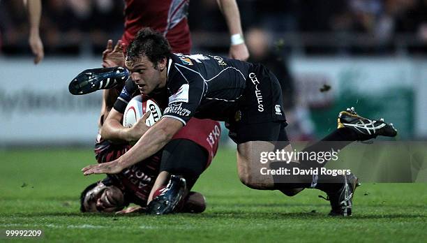 Phil Dollman of Exeter is tackled by Alaifatu Fatialofa during the Championship playoff final match, 1st leg between Exeter Chiefs and Bristol at...