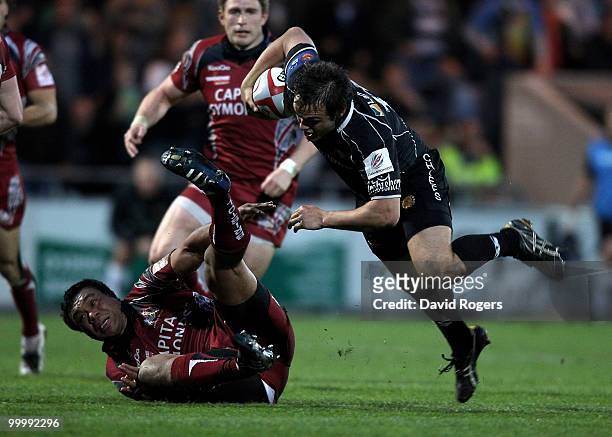 Phil Dollman of Exeter is tackled by Alaifatu Fatialofa during the Championship playoff final match, 1st leg between Exeter Chiefs and Bristol at...