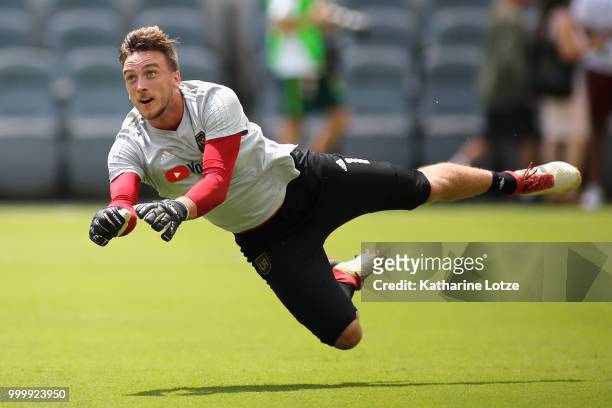Tyler Miller of the Los Angeles Football Club blocks a shot on goal during a warm up exercise before action against the Portland Timbers at Banc of...