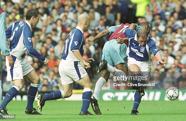 Paul Gascoigne of Everton hits the ball away from Fredric Kanoute of West Ham during the match between Everton and West Ham United in the FA...