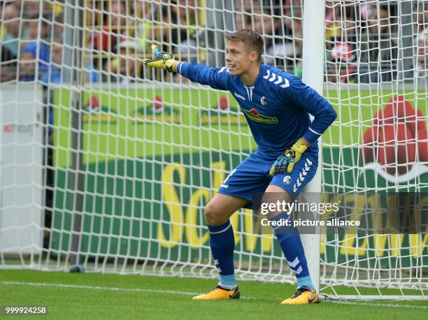 Freiburg's goalkeeper Alexander Schwolow in action during the German Bundesliga soccer match between SC Freiburg and Borussia Dortmund in the...