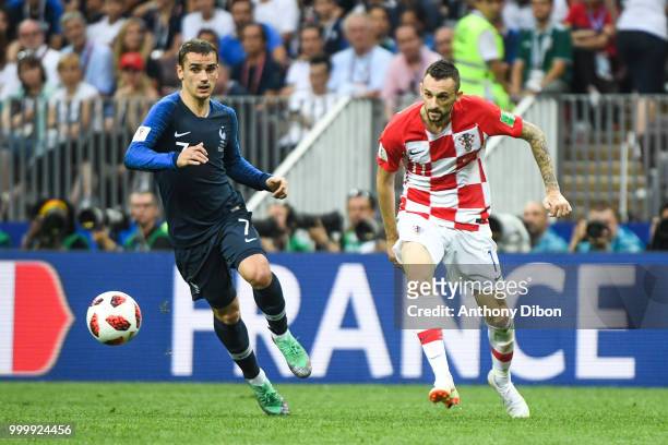 Antoine Griezmann of France and Marcelo Brozovic of Croatia during the World Cup Final match between France and Croatia at Luzhniki Stadium on July...