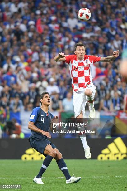 Raphael Varane of France and Mario Mandzukic of Croatia during the World Cup Final match between France and Croatia at Luzhniki Stadium on July 15,...