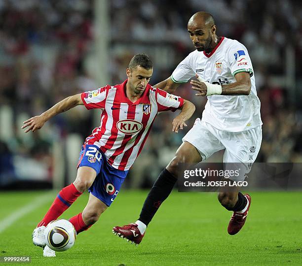 Atletico Madrid's Portuguese midfielder Simao Sabrosa fights for the ball with Sevilla's Malian forward Frederic Kanoute during the King's Cup final...