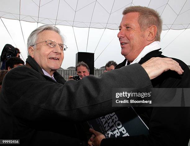 Jean-Claude Trichet, president of the European Central Bank , left, greets architect Wolf Prix of Coop Himmelblau, at a ceremony to lay the...
