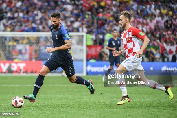 Olivier Giroud of France and Ivan Rakitic of Croatia during the World Cup Final match between France and Croatia at Luzhniki Stadium on July 15, 2018...