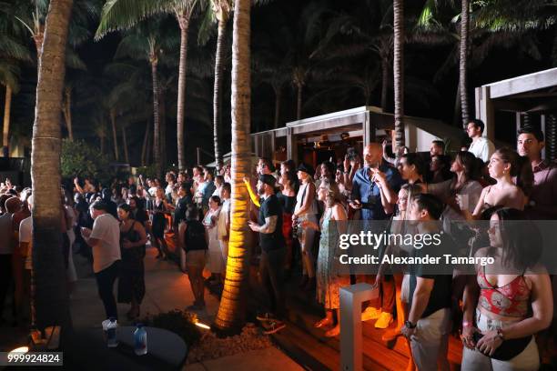 Guests attend the 2018 Sports Illustrated Swimsuit show at PARAISO during Miami Swim Week at The W Hotel South Beach on July 15, 2018 in Miami,...