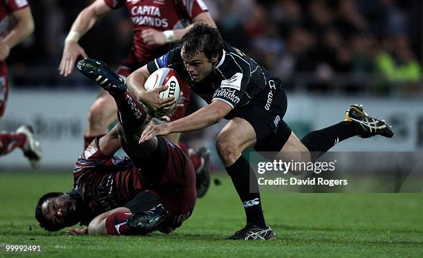 Phil Dollman of Exeter is tackled by Alaifatu Fatialofa during the Championship playoff final match, 1st leg between Exeter Chiefs and Bristol at...