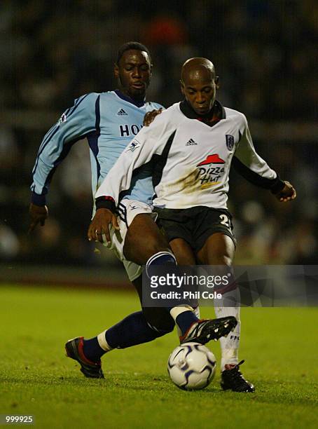 Ledley King of Tottenham Hotspur tries to tackle Luis Boa Morte of Fulham during the Worthington Cup, 4th Round between Fulham and Tottenham Hotspur...