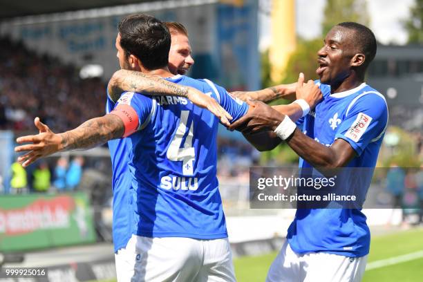 Darmstadt's Aytac Sulu celebrates his 1:0 goal with Wilson Kamavuaka during the German 2nd Bundesliga soccer match between Darmstadt 98 and VfL...