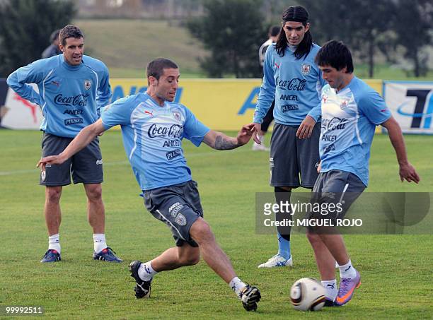 Players Sebastian Euguren , Nicolas Lodeiro , Sebastian Abreu and Andres Scotti take part in a training session of the Uruguayan national football...