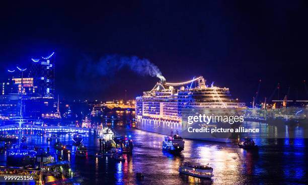 The cruise ship 'MSC Preziosa' can be seen during the final parade of the cruise festival Hamburg Cruise Days at the Elbe river in Hamburg, Germany,...