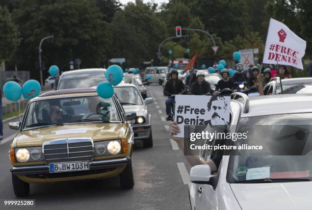 Participants of a car and bicycle parade for the German journalist Deniz Yuecel who is imprisoned in Turkey drives through the government district in...