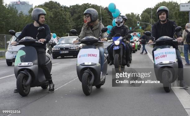Participants of a car and bicycle parade for the German journalist Deniz Yuecel who is imprisoned in Turkey drives through the government district in...