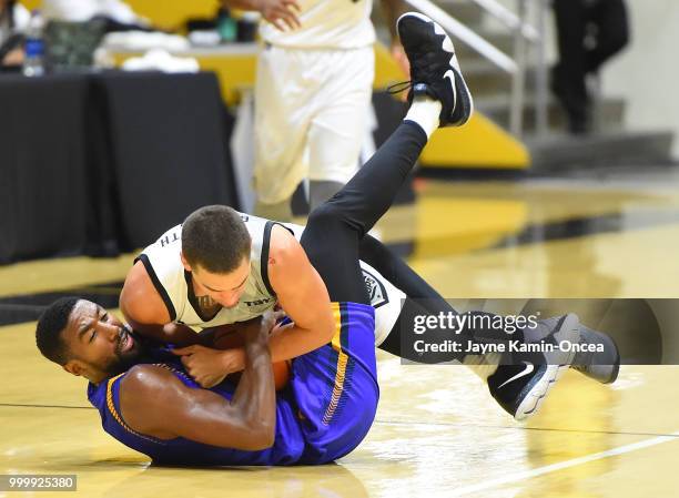 Scott Bamforth of the Albuquerque Hoops and Malcolm Lee of the Sons of Westwood battle for a loose ball during the Western Regional of The Basketball...