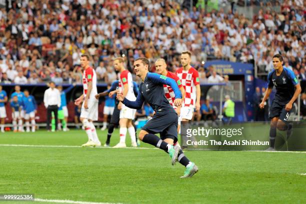 Antoine Griezmann of Croatia celebrates scoring his side's second goal fro the penalty spot during the 2018 FIFA World Cup Final between France and...