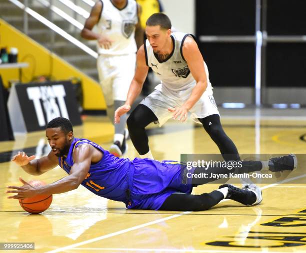 Scott Bamforth of the Albuquerque Hoops and Malcolm Lee of the Sons of Westwood battle for a loose ball during the Western Regional of The Basketball...